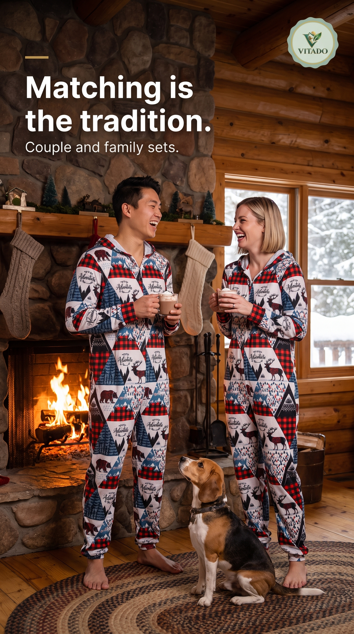 Couple in matching Christmas print onesies by a fireplace
